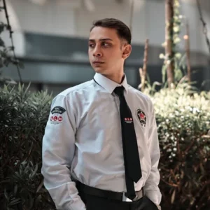 Professional security guard in uniform standing outdoors - unarmed security training