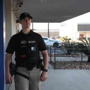 Security guard patrolling outdoor area in professional uniform